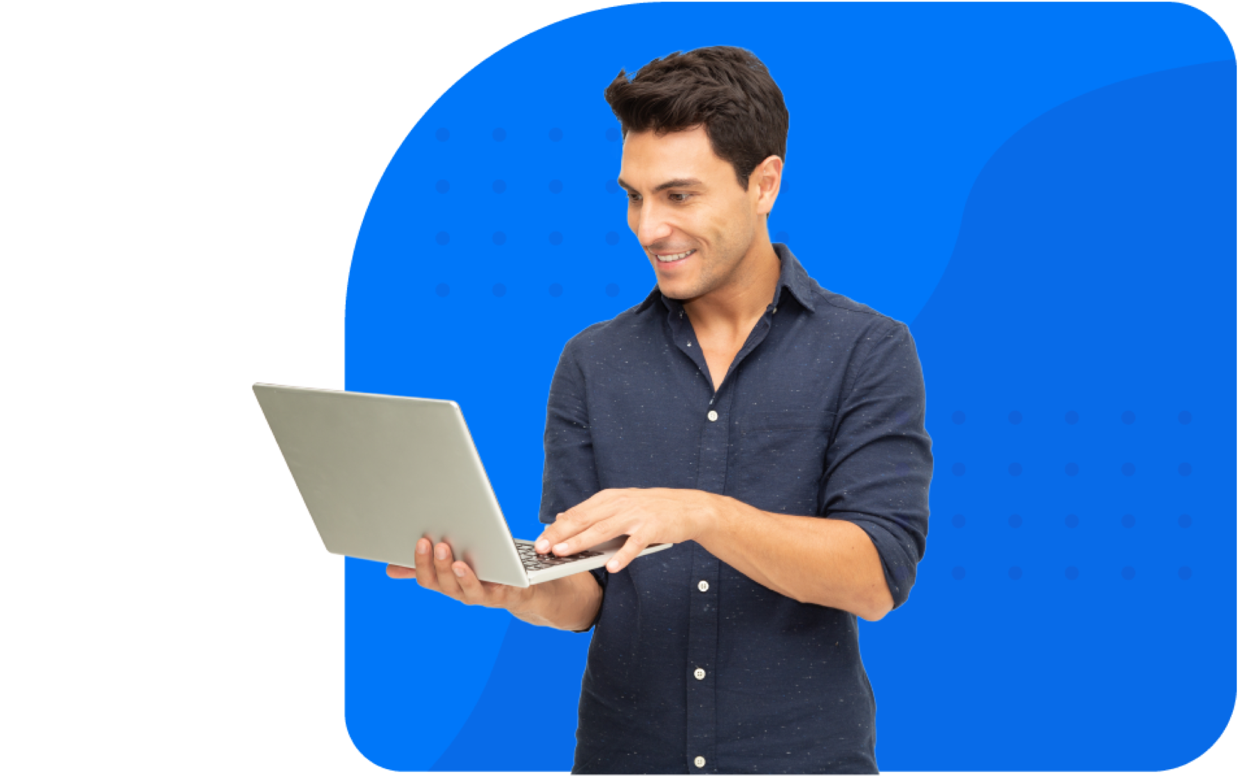 Smiling man standing with laptop in hands